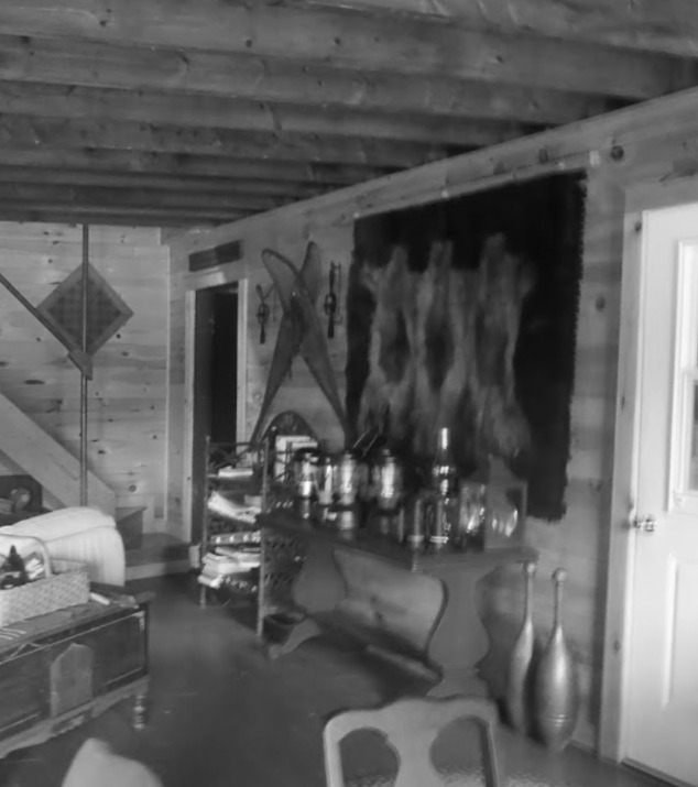Interior of the old camp with Coleman lanterns on the table