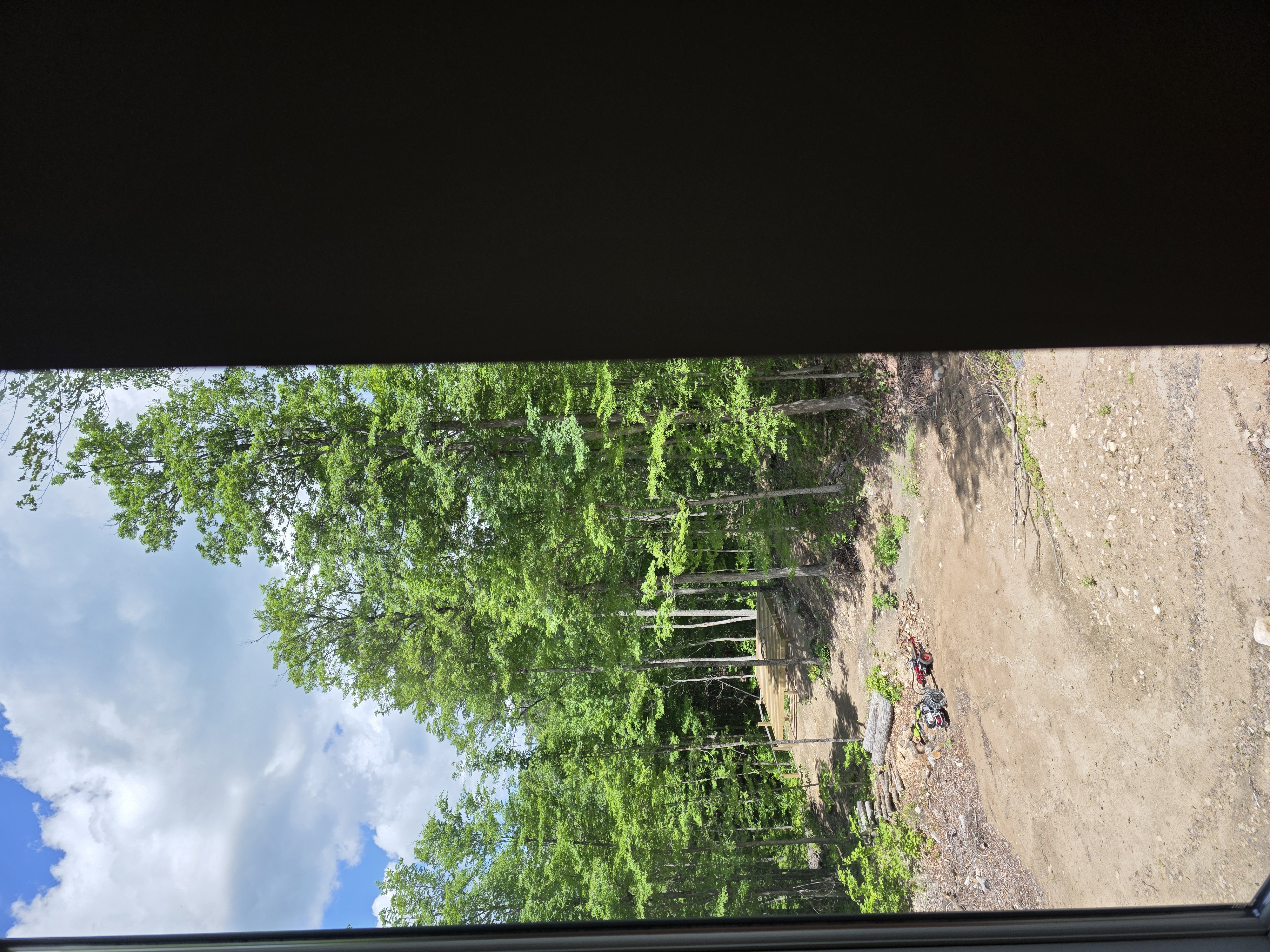 Obstructed fixed window-frame view toward the Sentinel